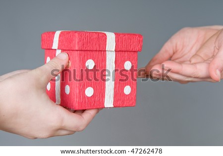 One person giving gift to another