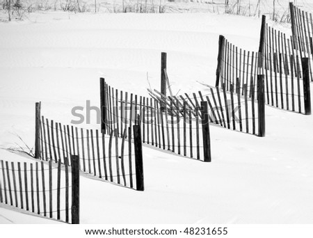 Sand dune fence with one section broken
