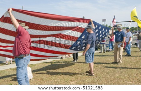 PENSACOLA - APRIL 15:  An estimated 1000 tax day Tea Party protesters peacefully assembled to voice their concern over government spending on April 15, 2010 in Pensacola, Florida.