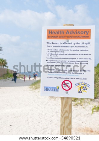 PERDIDO KEY - JUNE 9: A health hazard sign is shown posted on a popular vacation resort beach on June 9, 2010 in Perdido Key, Florida.  Oil threatens wildlife and tourism in the area.