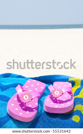 Flip flops on beach towel