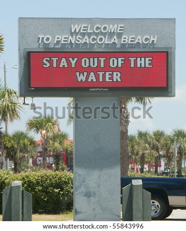 PENSACOLA BEACH - JUNE 23:  An electronic warning sign alerts beachgoers that the waters are closed on June 23, 2010 in Pensacola, FL.