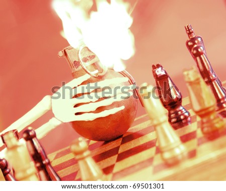 skeleton playing chess with hand grenade