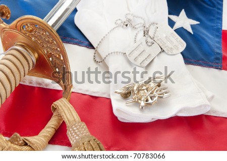 Navy SEAL trident and uniform items on flag