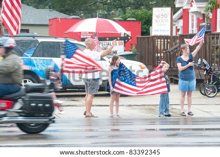PENSACOLA - AUGUST 24:  Patriot Guard Riders escort the fallen body of 19 year old US Marine Lance Cpl Travis Nelson as he is returned home from Afghanistan to Pensacola, FL on August 24, 2011.