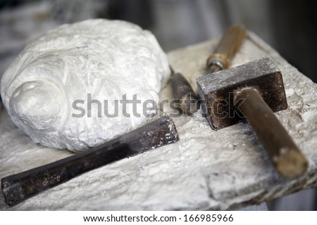 alabaster stone and tools for working stone hammer chisel