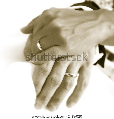 hands over wedding dress