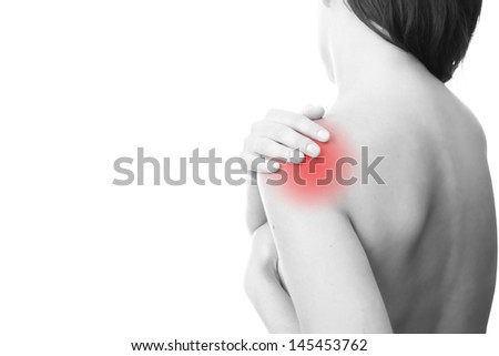 Hands on a woman's shoulder Pain in the muscles Hands on a woman's shoulder Pain in the muscles