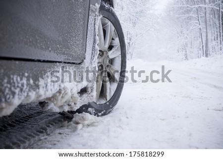 Winter tire on snow-covered road.