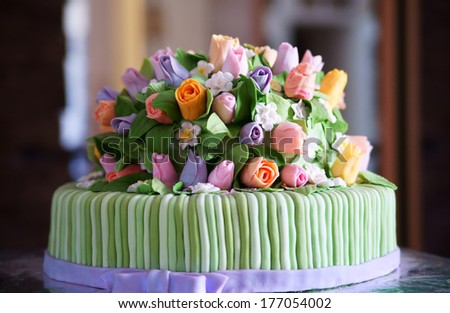 Beautiful tasty cake with roses of cream.