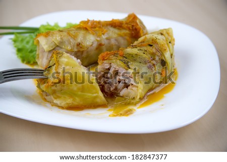 Cabbage rolls on a white plate. Dinner time
