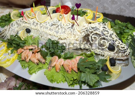 Baked sturgeon. Festive dish of fish and seafood.