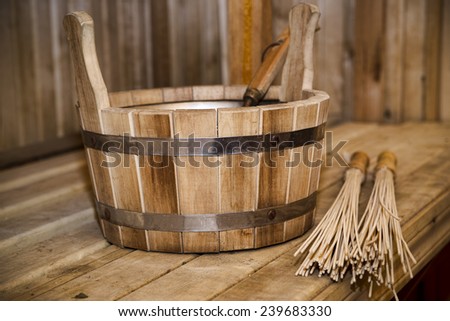 Sauna, bath accessories. Wooden bucket and sticks