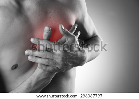 Heart attack. Pain in the human body.  Black and white photo with red dot