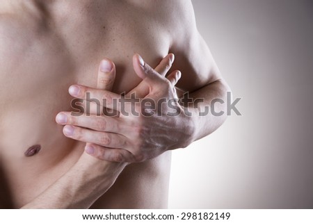 Heart attack. Pain in the human body on gray background.
