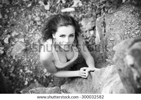 Portrait of a beautiful young woman on nature. Black and white photography