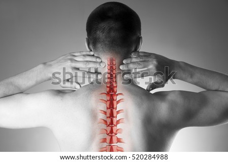 Spine pain, man with backache and ache in the neck, black and white photo with red backbone on gray background
