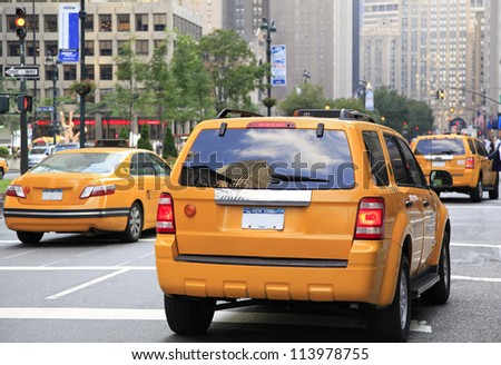 NEW YORK - AUG 24: Busy yellow taxis in traffic. The taxicabs, with their distinctive yellow paint, are a widely recognized icon of the city on August 24, 2012 in New York, USA.