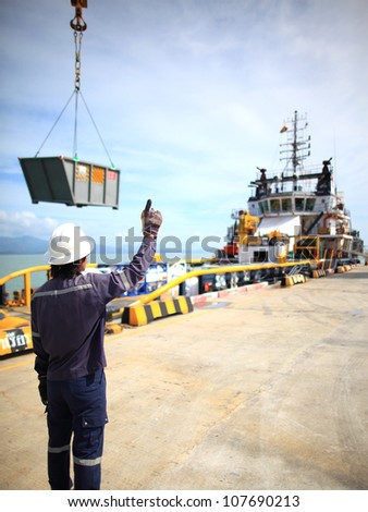 Harbor worker - watching the loading operation