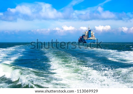 Cargo ship sailing in to the sea