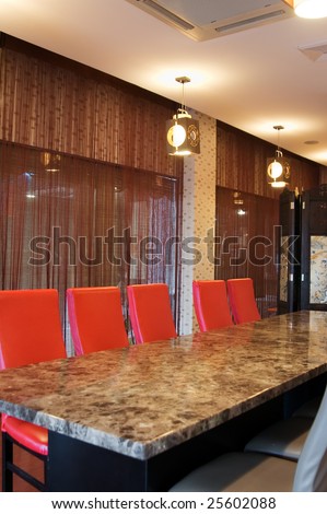 The classic conference office with  long formal table and chairs.
