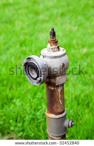 Fire hydrant without key with green grass background