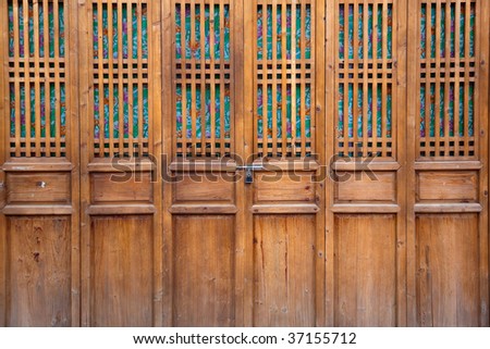 Chinese old wooden door in a ancient building,this style is used in several hundred years ago