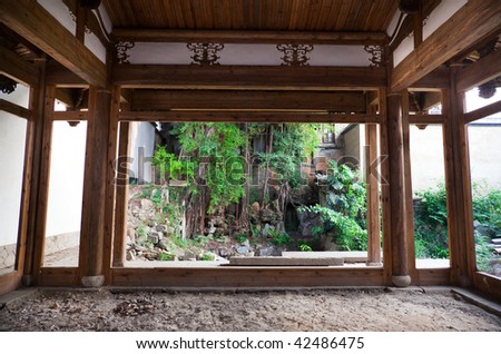 Chinese style backyard viewed from a old empty house.This backyard and house are  a typical architectural style of the Ming and Qing Dynasties in southeast China