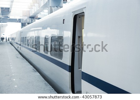 High-speed  MU(Multiple Unit) train on platform with opening door waiting for people get on in China