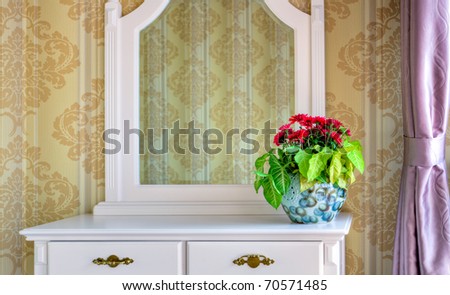 Bouquet of flowers on a dressing table in a living room