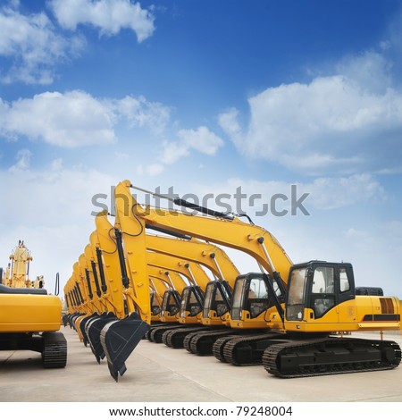shiny and modern yellow excavator machines