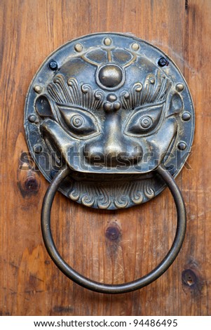 Chinese unicorn door knob on wood.Chinese unicorn, also name kylin,is an auspicious symbol in china