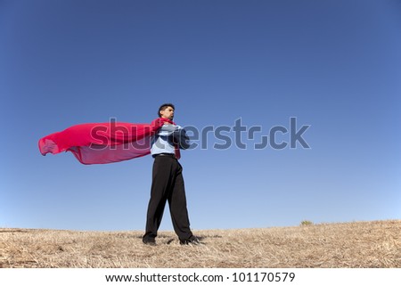 Businessman with a red flying cape like superman