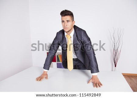 Modern and powerful businessman at his office