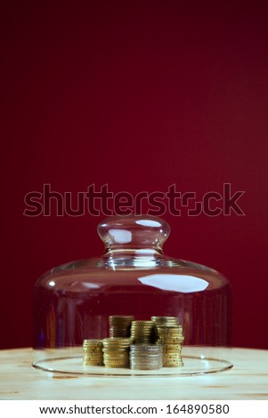 Money protected inside a glass shield