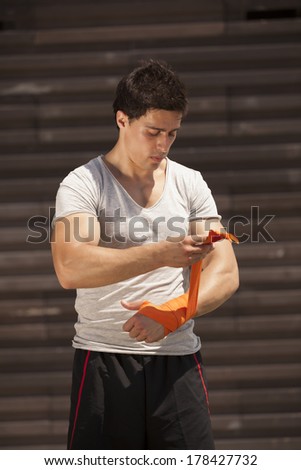 Kickboxing athlete male preparing him self