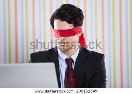 Blind businessman working at the office
