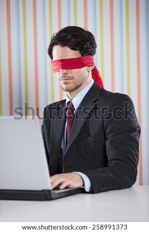 Blind businessman working at the office