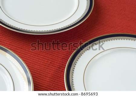 porcelain plates in a perspective over red (selective and soft focus)