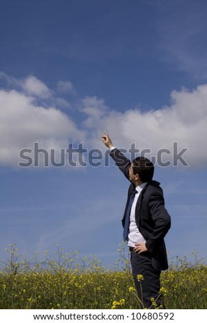 businessman showing the way to the future in perfect harmony with nature (with copy space)