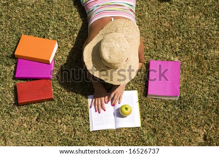 a student relaxing at the grass of the school park (the pages in the book are my self printed)