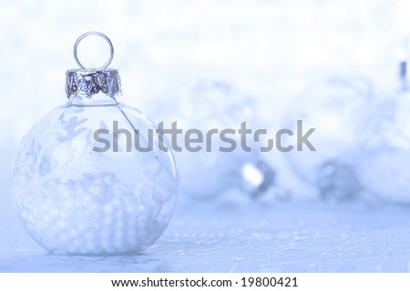 christmas cold background, with snow and christmas balls (selective focus)