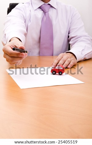 businessman selling a new car at his office (selective focus)