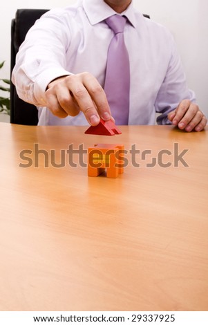 businessman selling a new house at his office (selective focus)