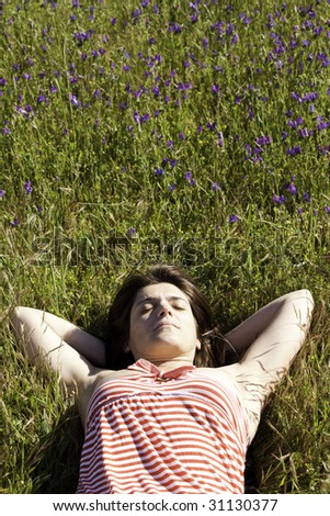 woman enjoying life in a green field