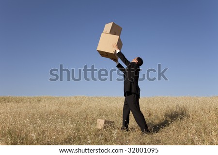 businessman with an open box at the field