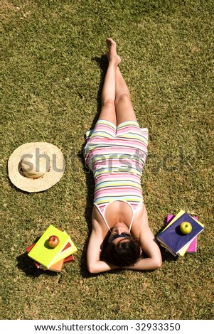 a student relaxing at the grass of the school park (the pages in the book are my self printed)