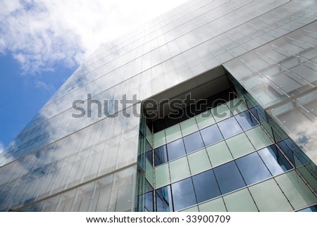 detail of a modern office building with sky reflection