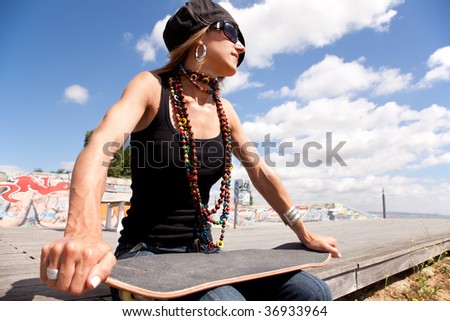 cool skateboard woman at a public graffiti park
