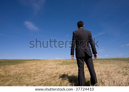 businessman showing his success at the field
